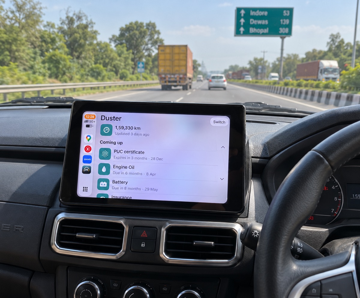 MotorBabu on CarPlay in a Renault Duster on the highway to Indore: 1,59,330 km, with PUC, engine oil and battery coming up